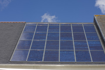 Fototapeta premium many solar cells on a roof
