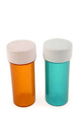Two plastic pill containers isolated on white