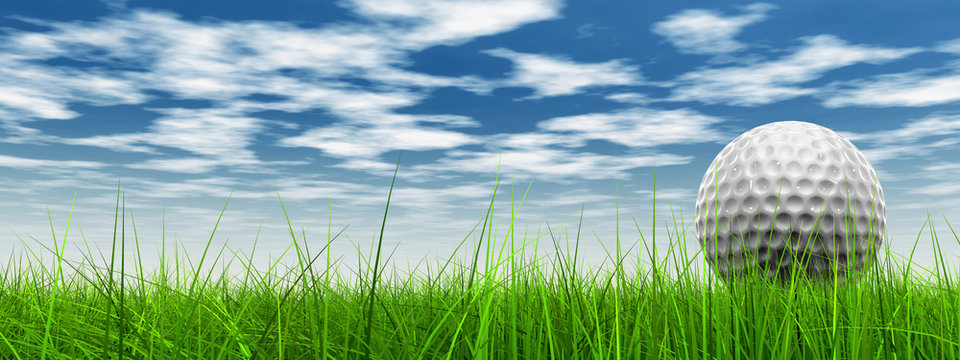 conceptual 3D golf ball on green grass over a blue sky