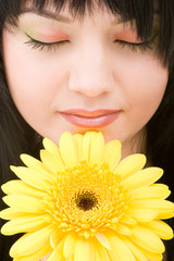 Young woman with gerber flower