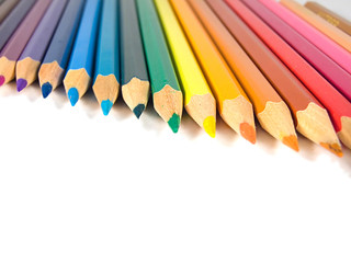 Assortment of colored pencils on white background