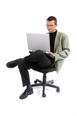 Man  with laptop sitting on chair