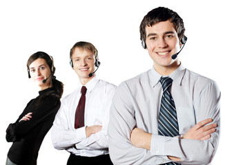 Isolated group of young happy business people in headsets