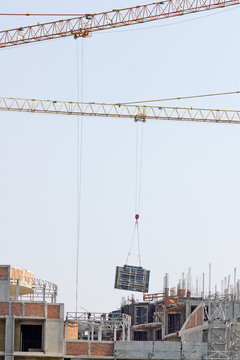 Construction site with cranes and workers