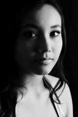Beautiful young model in the studio - black and white portrait