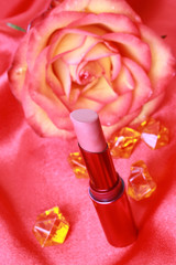 Obraz na płótnie Canvas Lipstick on red background