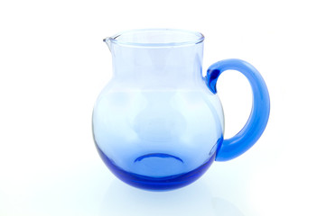 Blue glass watering can isolated on white background