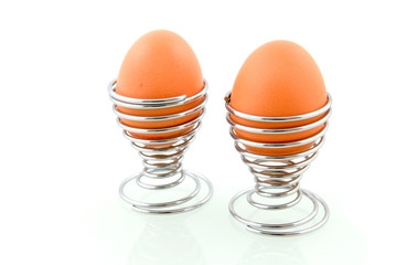 Two eggs in egg-shell isolated on white background