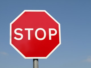Stop sign on the blue background.