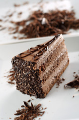 Chocolate cake on white plate