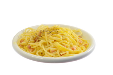 dish of spaghetti alla carbonara italian style isolated on white