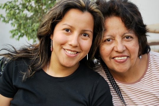 Hispanic mother and her grown daughter