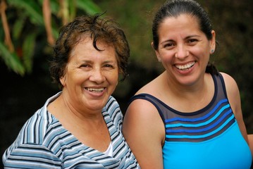 Hispanic mother and middle aged daughter