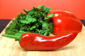 fresh red peppers on wood