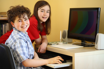 Kids using computer at home