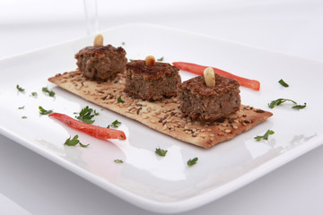 Baked kibbe on a toast