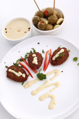 Fired kibbe, hummus tahina and olives