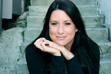 Fototapeta premium A beautiful student sitting on the steps