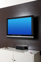 LCD television on wooden panel