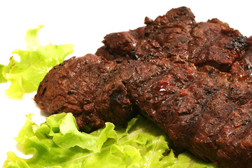 beef meat and green salad over white