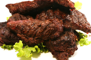 beef meat and green salad over white