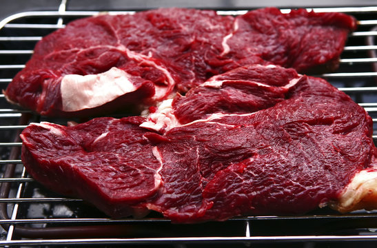 raw meat on bbq