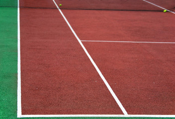 Tennis playground with balls and a net