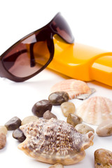 shells, sunglasses and lotion