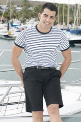 beautiful sailorman wearing sailor clothes in a yatch