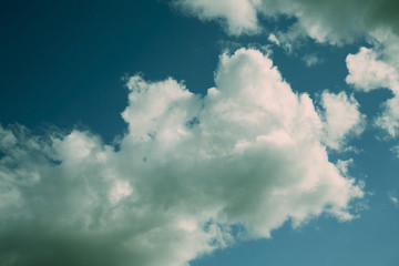 white fluffy clouds in the blue sky