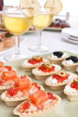 big banquet table with cocktails and canapes