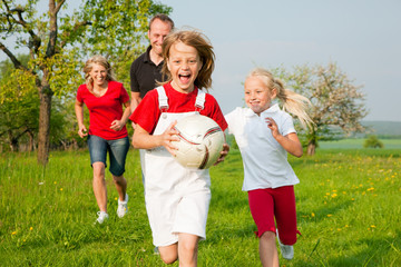Family playing ballgames