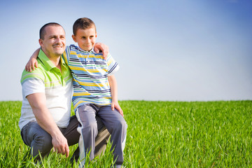 Father and son having good time outdoor