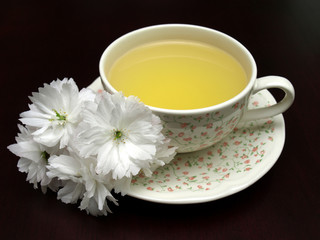 Obraz na płótnie Canvas Spring floral tea on a dark background
