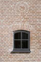 Brick wall with vintage window