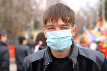 teenager in the mask on the street