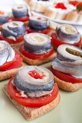 sandwiches with tomatoes and norwegian herring