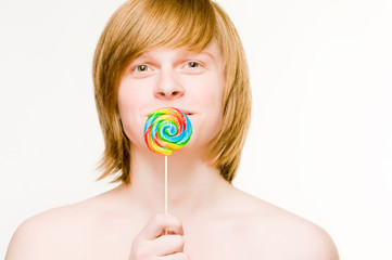 Young man with lollipop