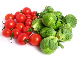 Brussels sprouts and cherry tomatoes, on white background