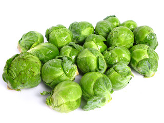 Fresh organic Brussels sprouts on white background