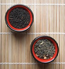 Porcelain cups for tea on bamboo straws