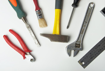 Working tools - a hammer, a brush, a screw-driver and others