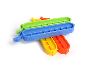 Clips for food Bags in various colors on white background