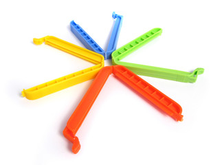 Clips for food Bags in various colors on white background