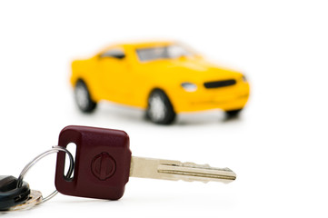 Car keys and car at background isolated on white