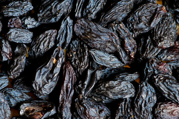 Background made of dark dried raisins