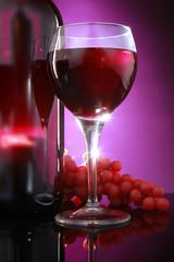 Red wine bottle and grapes