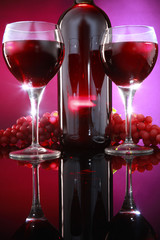 Red wine bottle and grapes