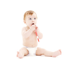 baby boy in diaper with toothbrush