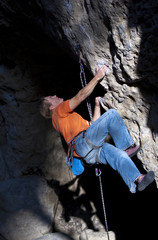 Climber going for the next handhold.